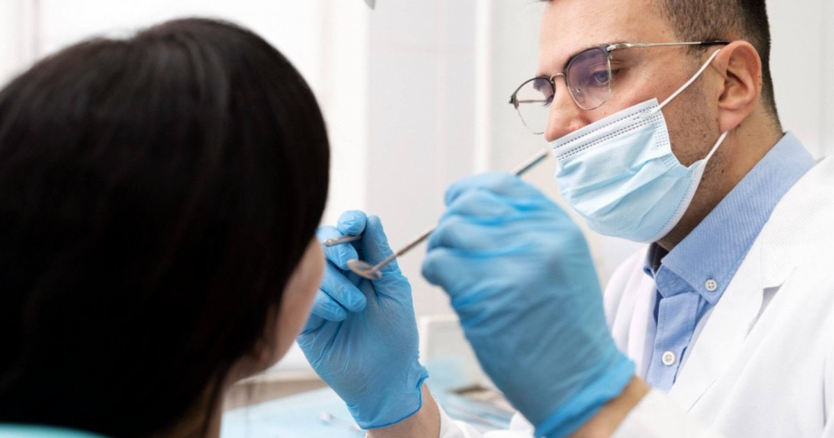 Albury dentist examining a patient's mouth